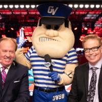 Louie and a broadcaster do the hand gesture for Lakers at the Detroit Red Wings GVSU Night